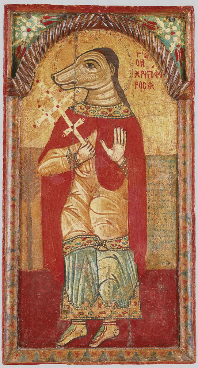 Mężczyzna o ludzkim korpusie i psiej głowie, trzymający w prawej ręce złoty krzyż